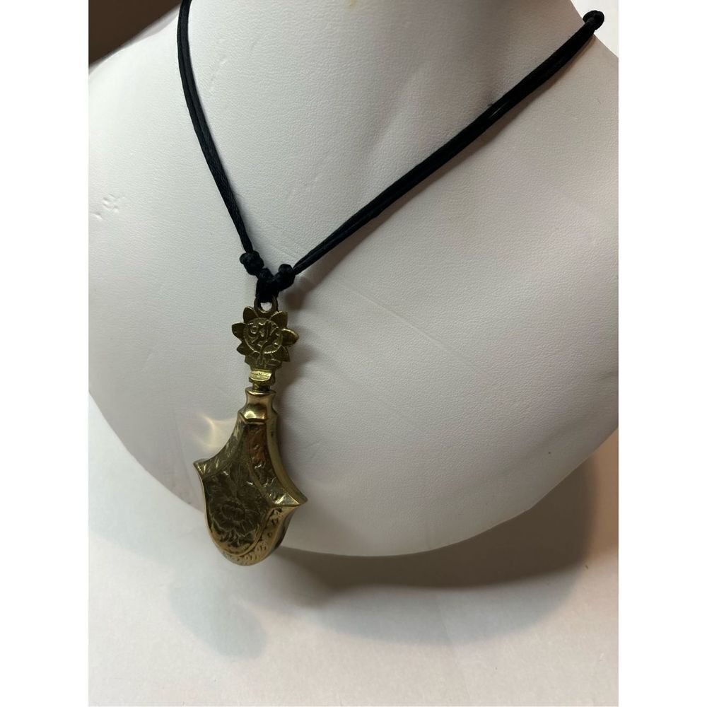 Islam eye liner bras pendant bottle 3”x1.5” on string, vintage